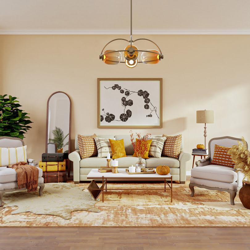 A warm and inviting living room with a neutral sofa, vibrant cushions, a sleek coffee table, a modern chandelier, and a decorative floor mirror, styled with autumnal accents.