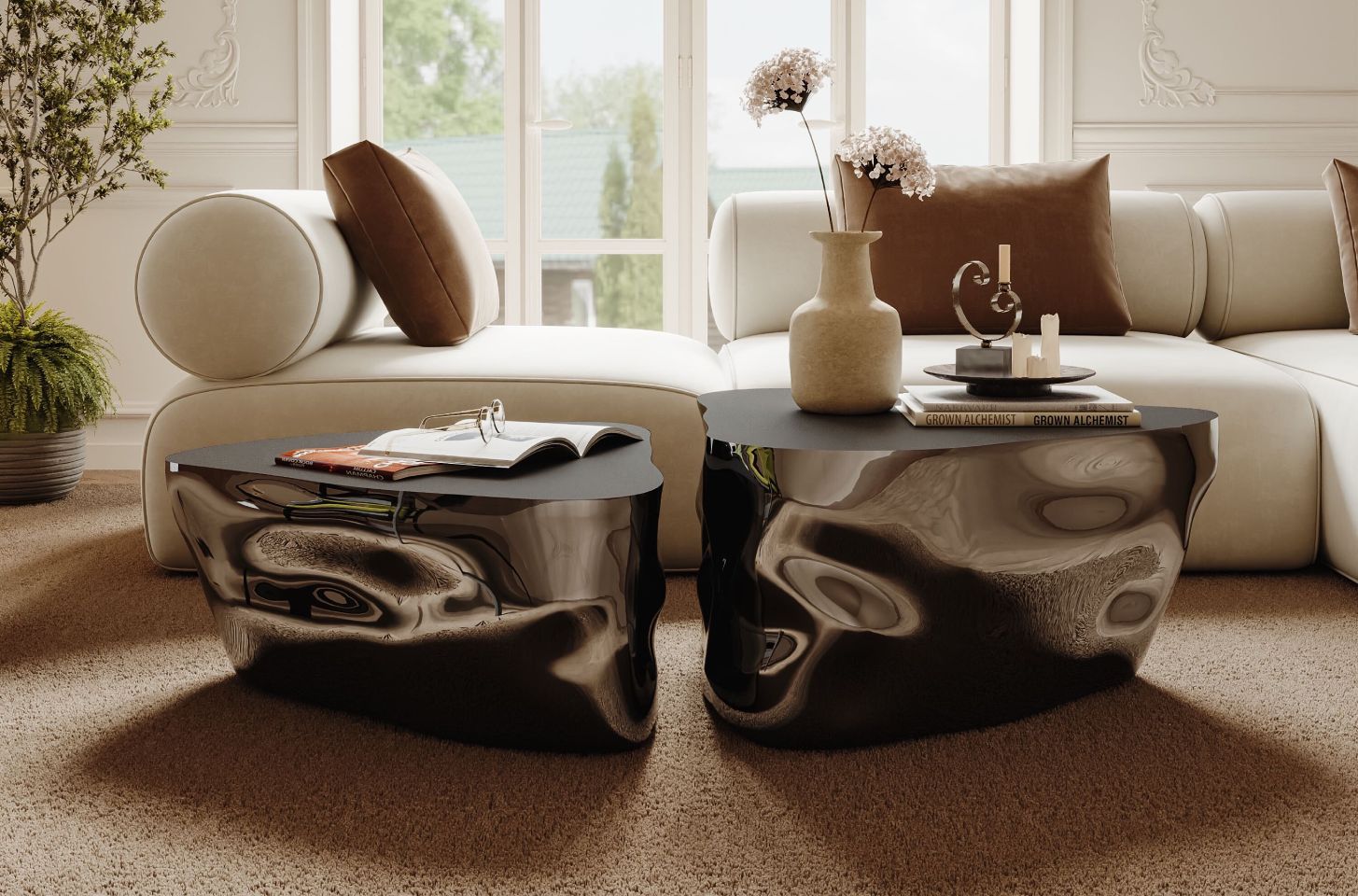 A luxurious living room featuring sculptural black gloss coffee tables, a cream sectional sofa with brown pillows, and elegant decor in soft natural light.