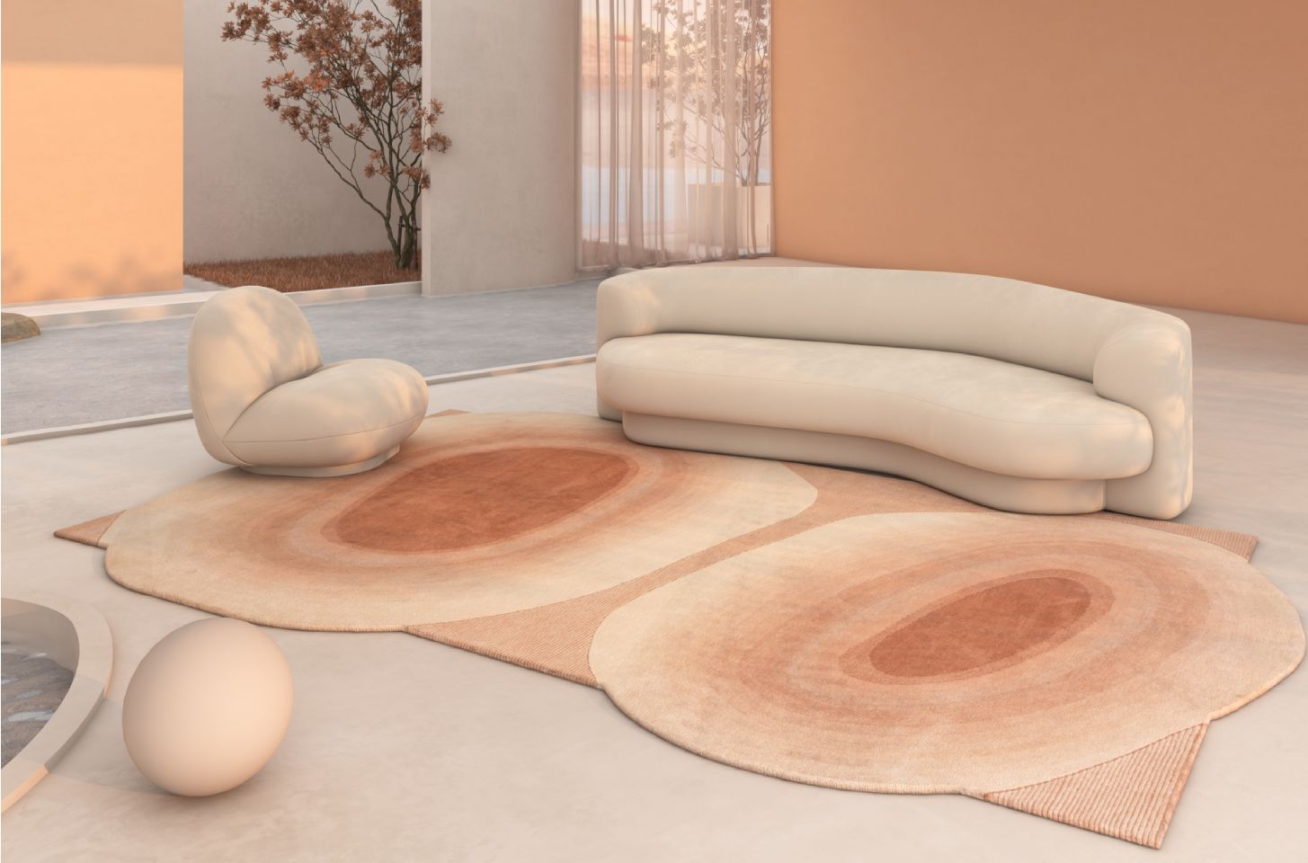 A serene, modern outdoor lounge featuring a sculptural cream sofa, a plush curved lounge chair, and layered organic-shaped rugs in warm earthy tones.