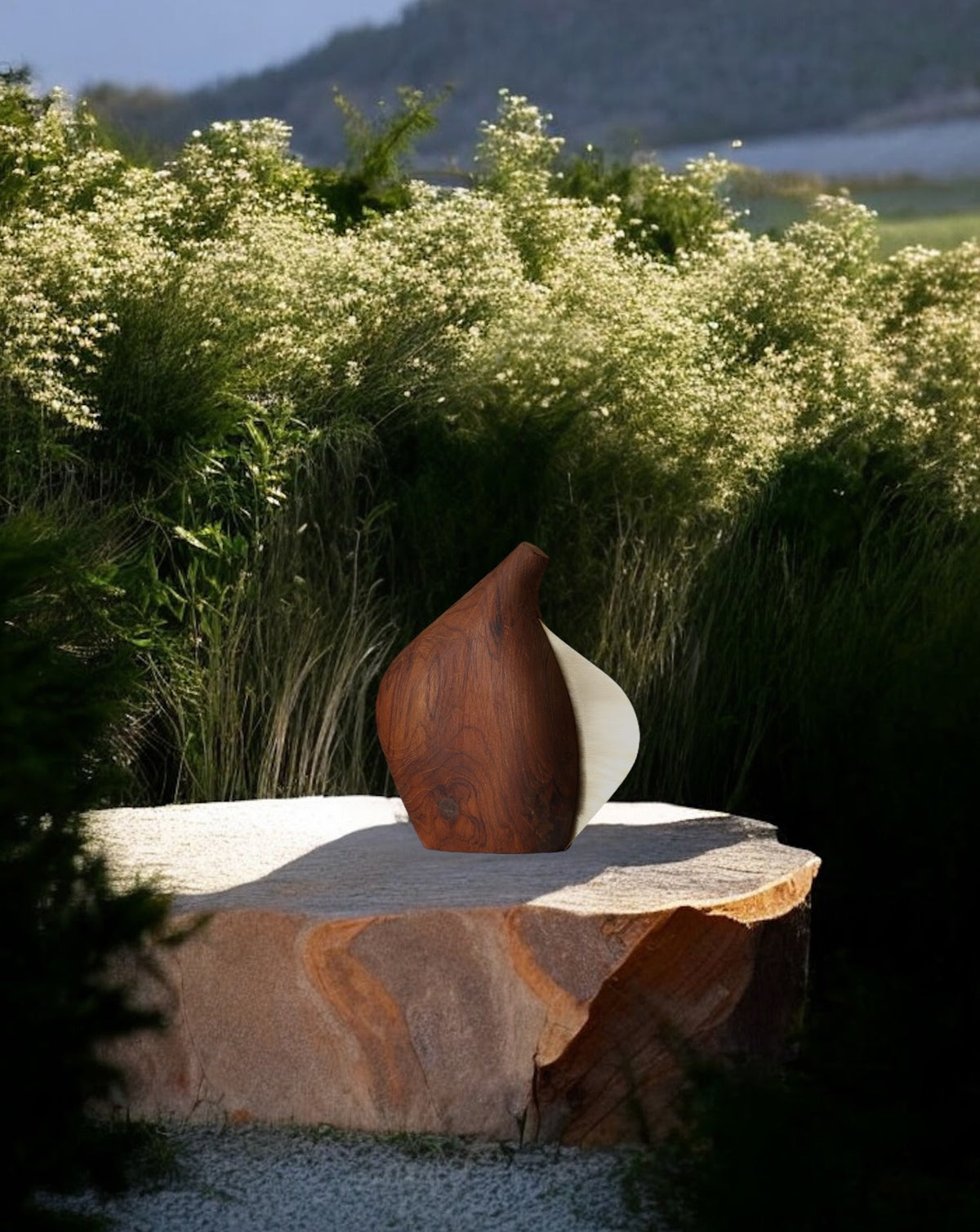 Sweeping curved teak silhouette with warm brass detail, handcrafted to order in India