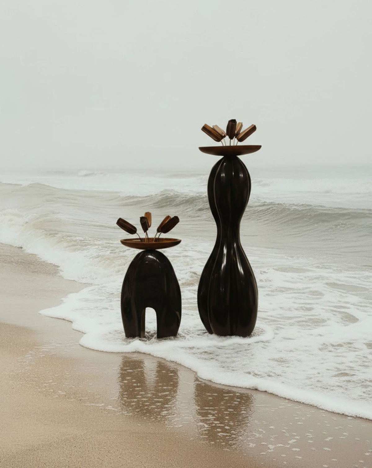 Solid black marble base carved with blended animal and human figures inspired by the forest