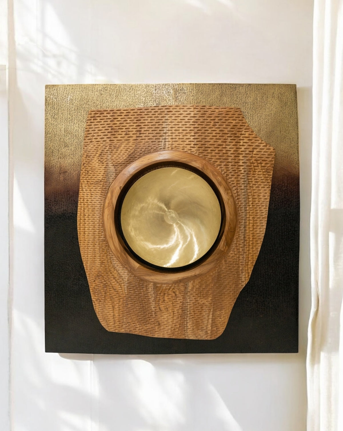 Detail of the patinated brass finish, its sunset warmth built up by hand in India