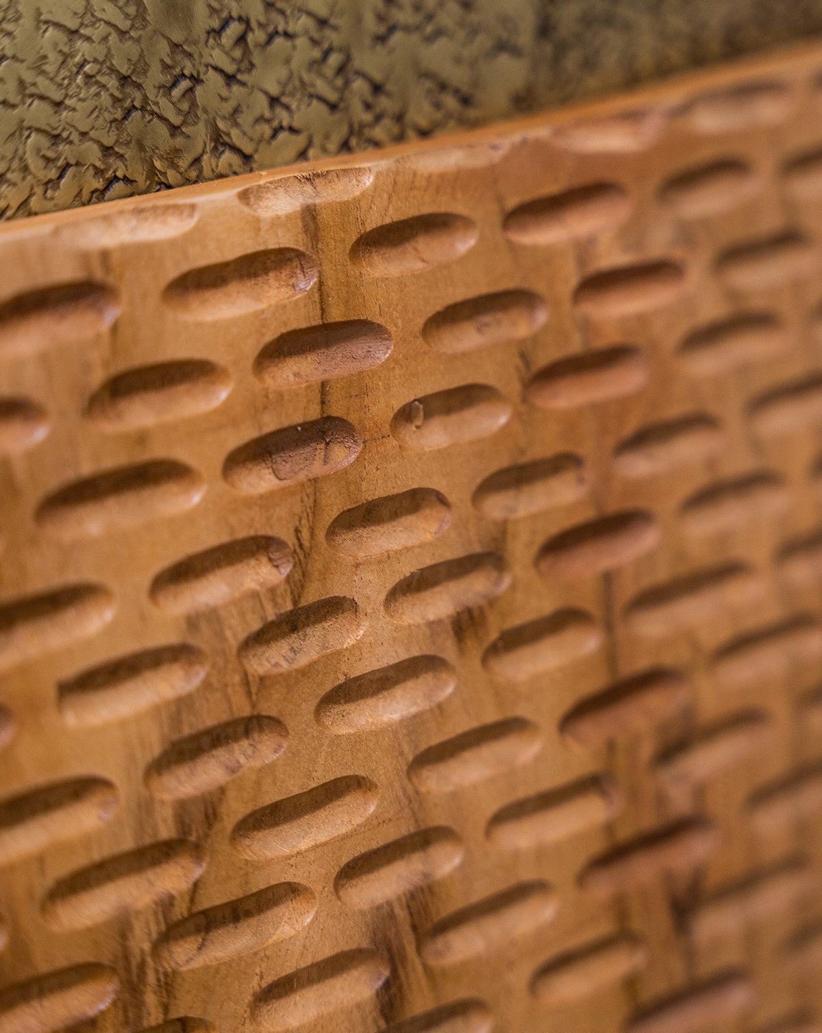 Side profile showing the depth of the recessed centre and its sculptural presence