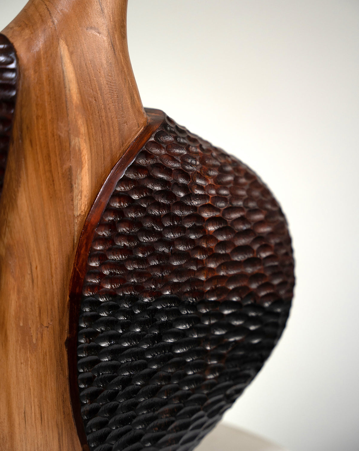 Indian craftsmanship expressed through seasoned teak and understated brass detailing