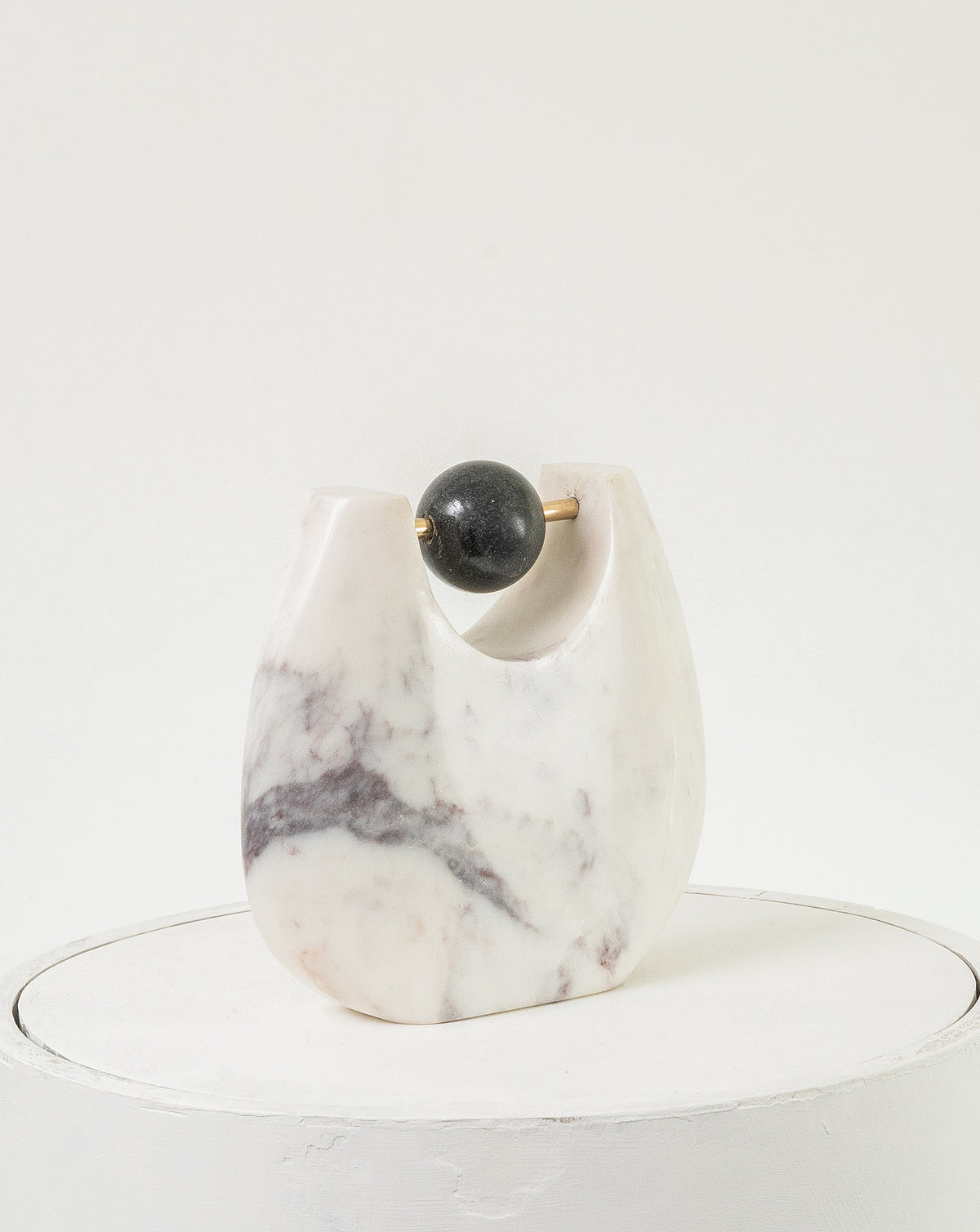 Made-to-order decorative object exploring the dialogue between weight and suspension