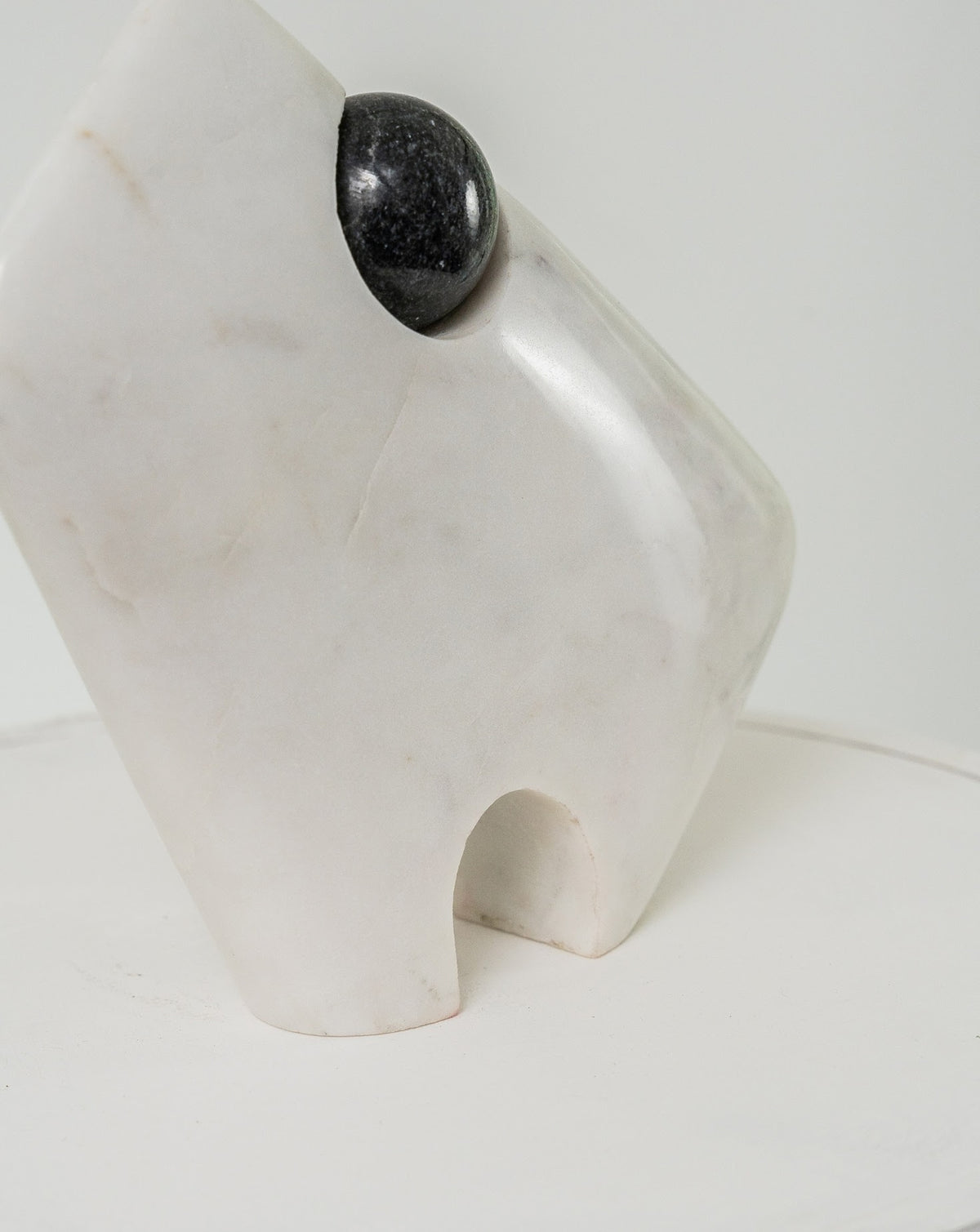 Detail of the carved marble profile and defined sculptural silhouette