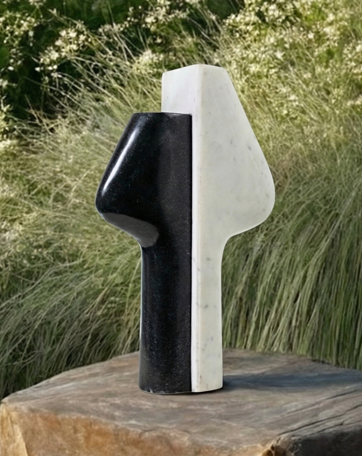 Minimalist marble vase standing 26 cm tall with a 19 cm wide sculptural form