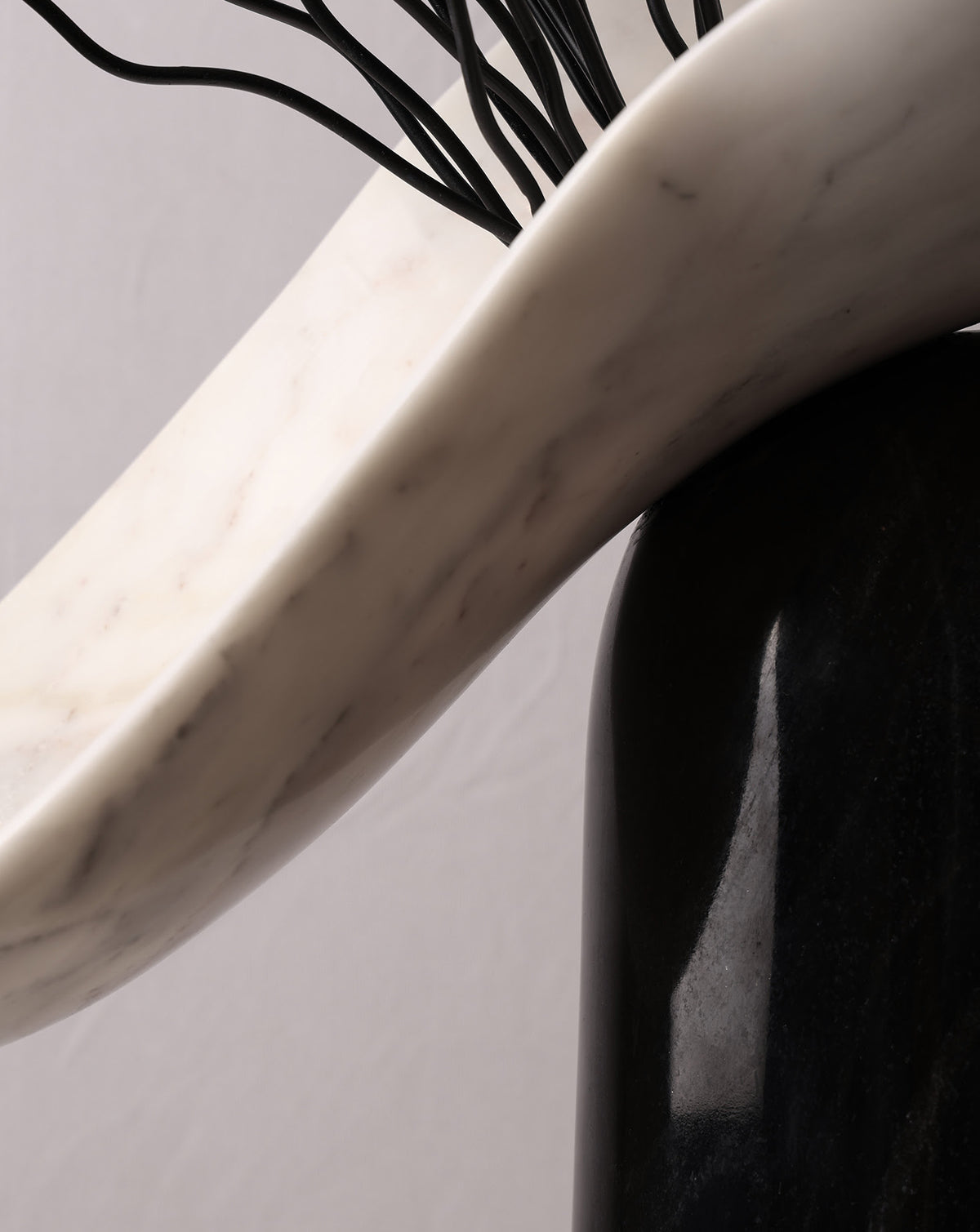 Sculptural marble form shown in profile, arriving fully assembled with no construction required