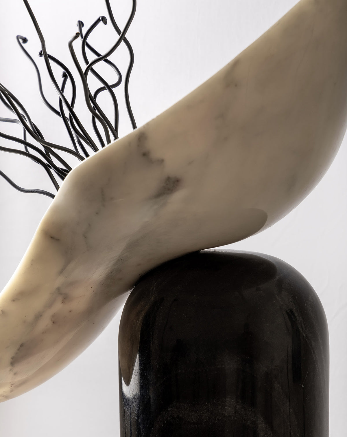 Contrasting black and white marble worked into a modern sculptural form for the living room