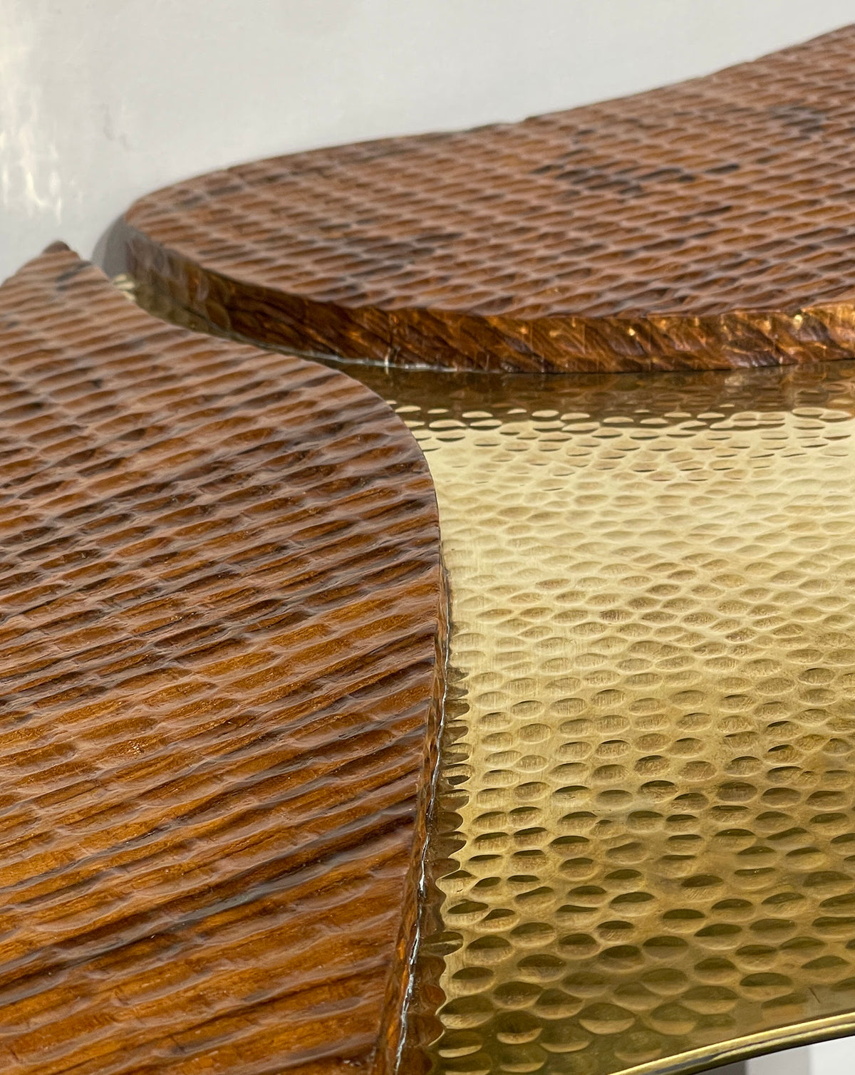 Brass detailing catching the eye against warm teak on this made-to-order Indian piece