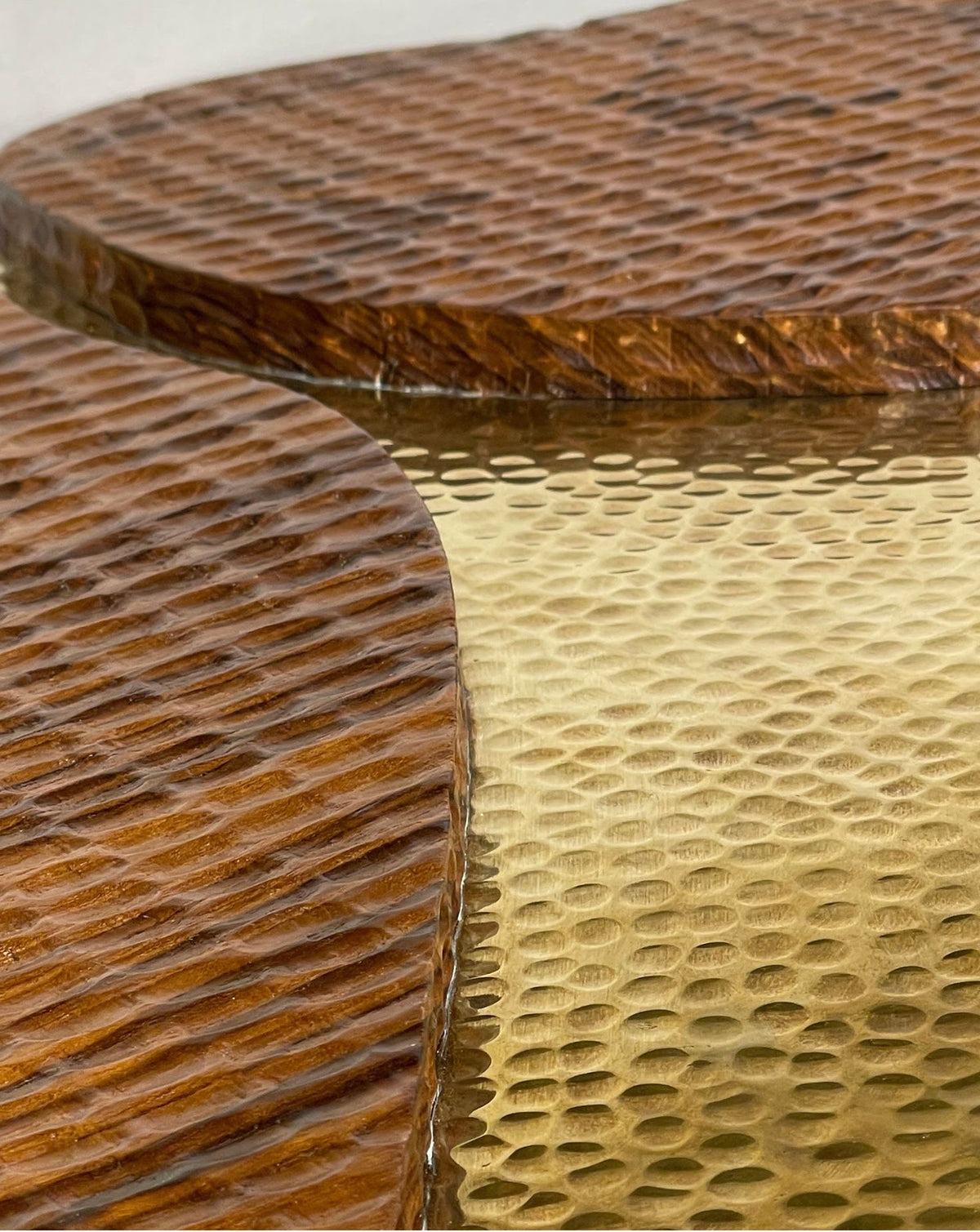 Golden brass against brown teak, a two-material palette for design-led living rooms