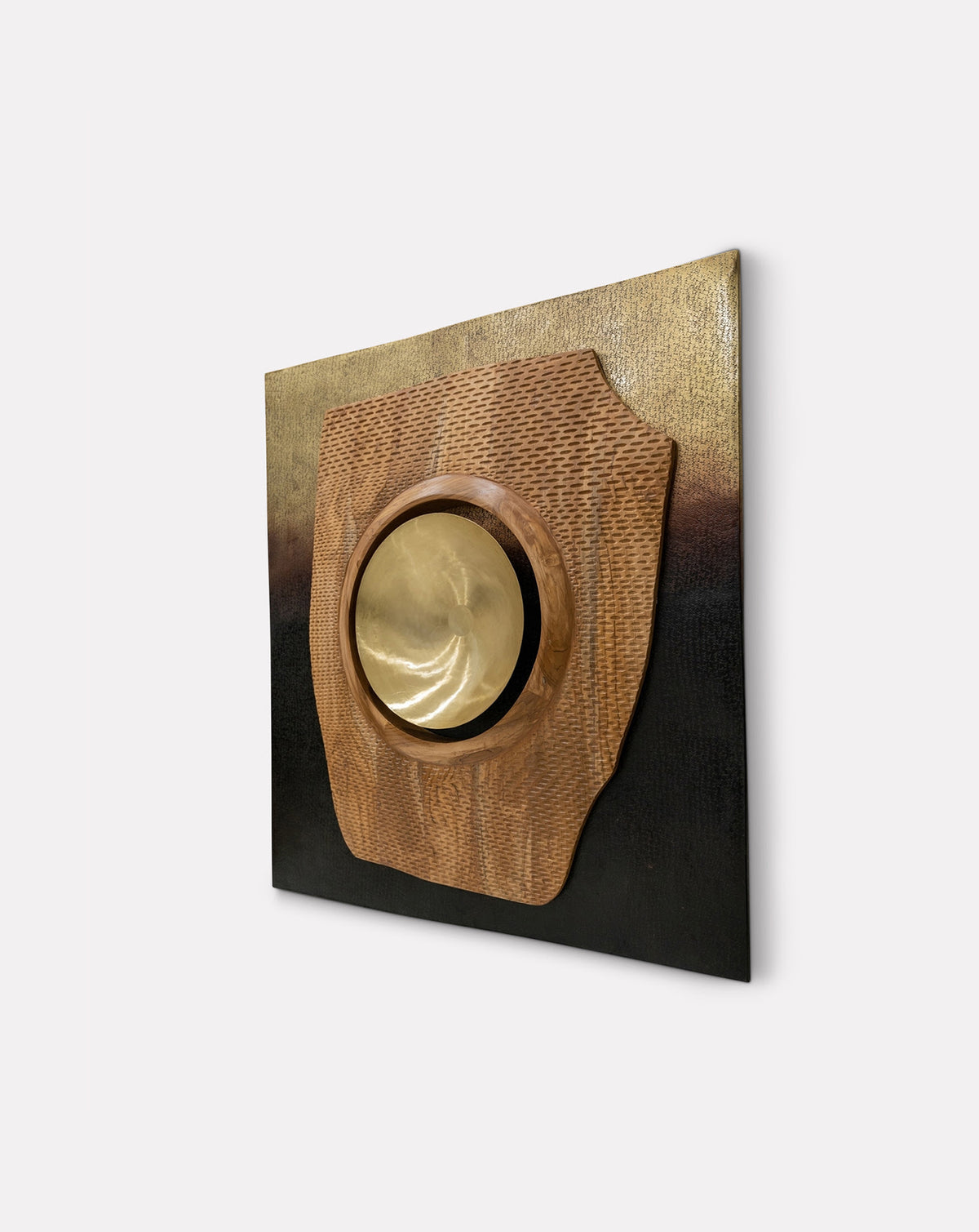 Contrast of warm patinated brass against grounded teak grain, surface and depth in one work