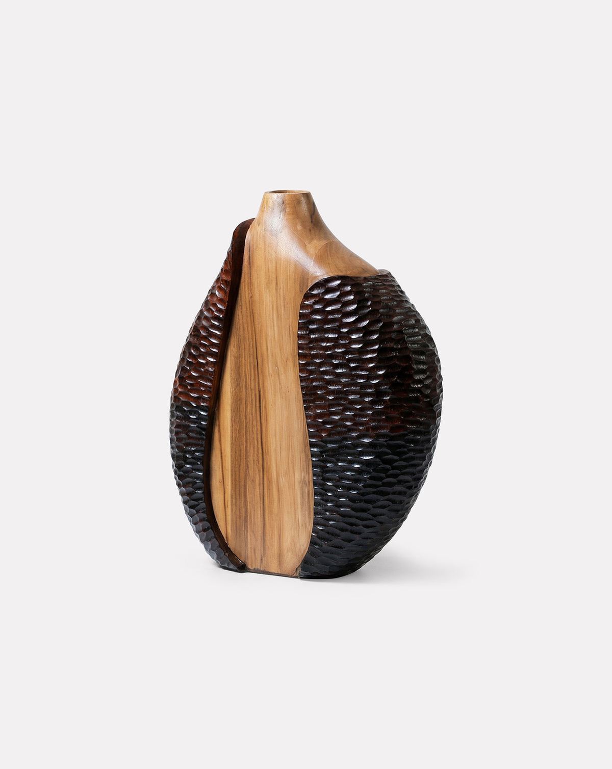 Close view of chiselled teak grain showing natural variation inherent to handcraft