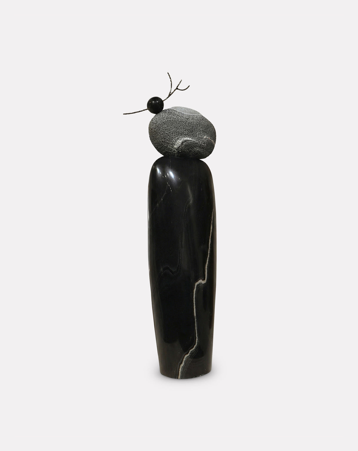 Brass accents set into the textured crown, symbolising fruit that nourishes the earth