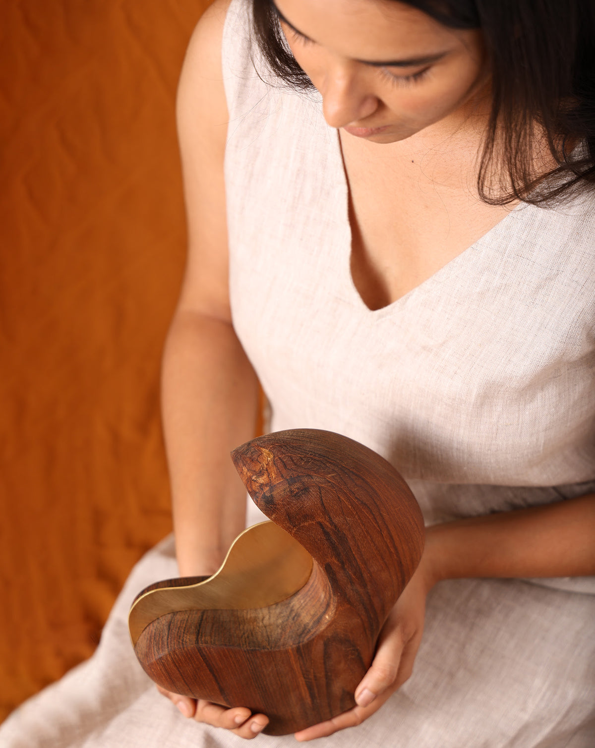 Brown and golden palette pairing warm timber with polished metal