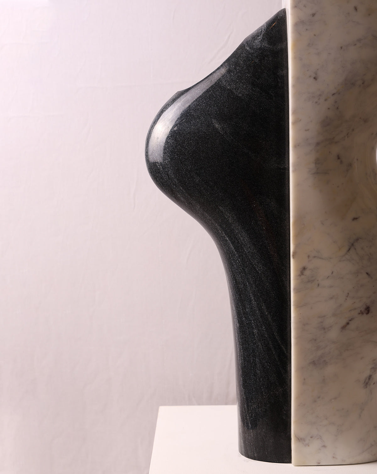Natural veining and grain across the polished black and white marble surface