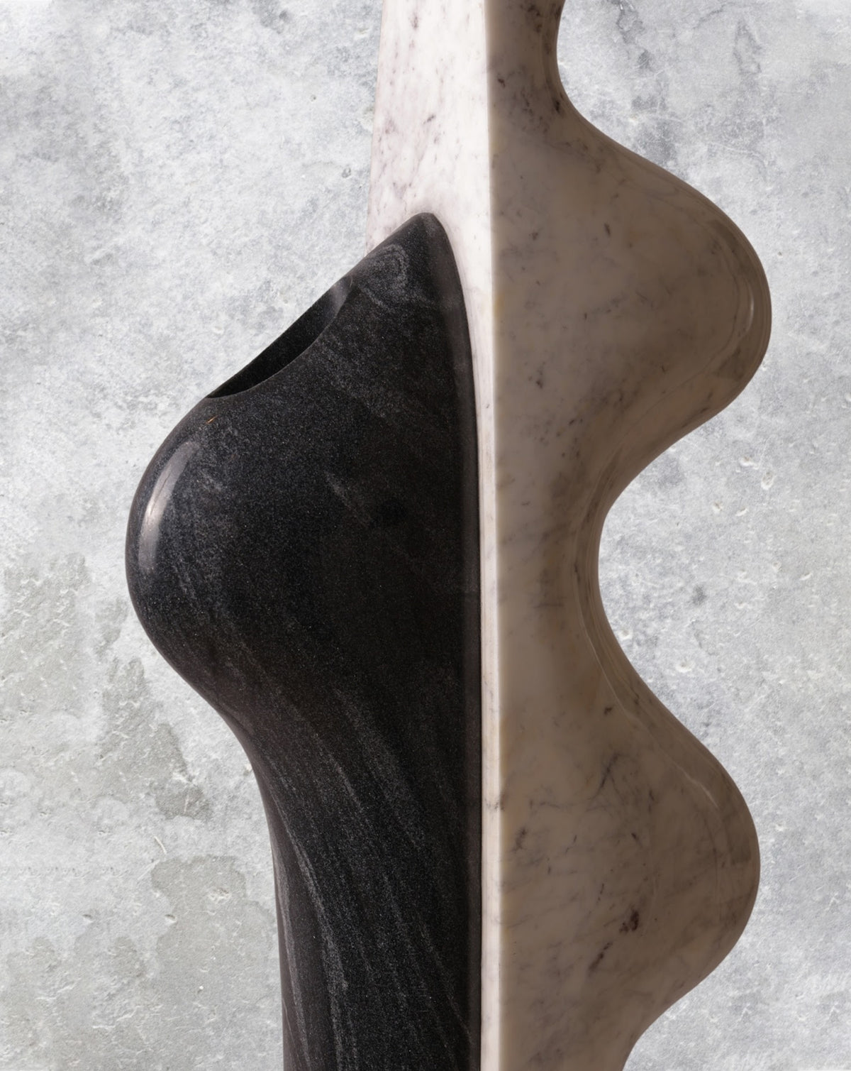 Detail of the hand-finished stone edge where tone and material meet