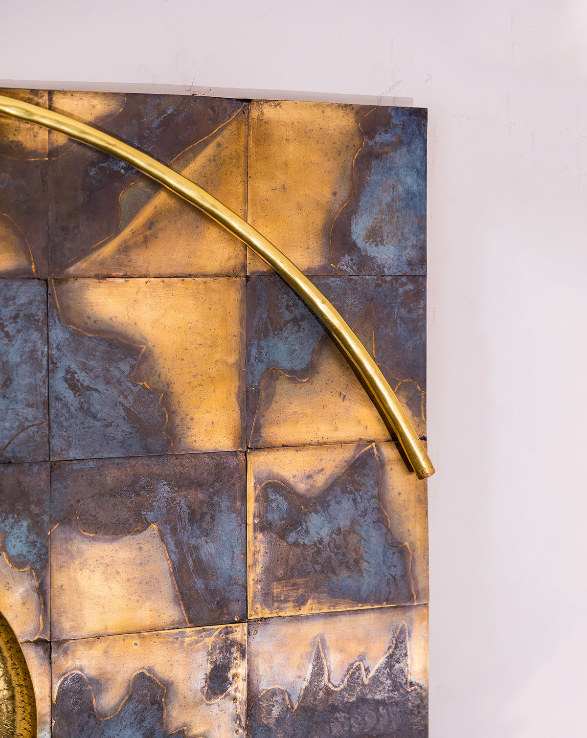 Textured centre disc contrasting raw and refined brass finishes