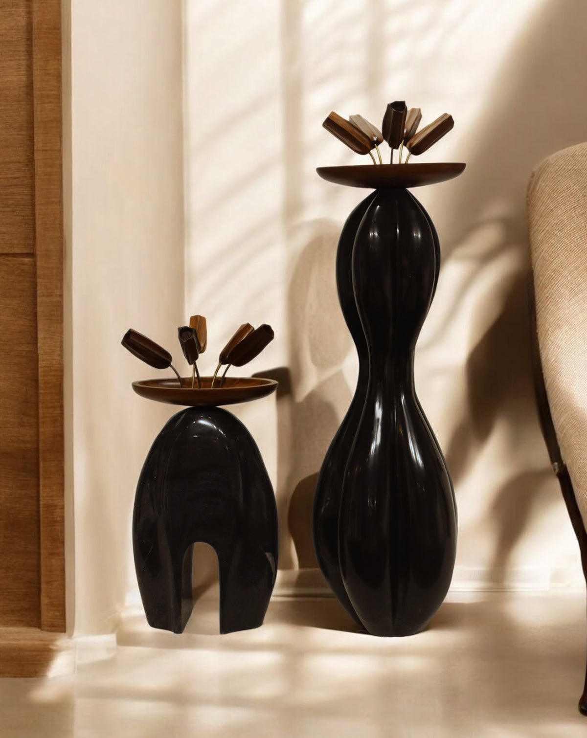 Hand-crafted teak wood pods ornamenting the top of the sculptural composition