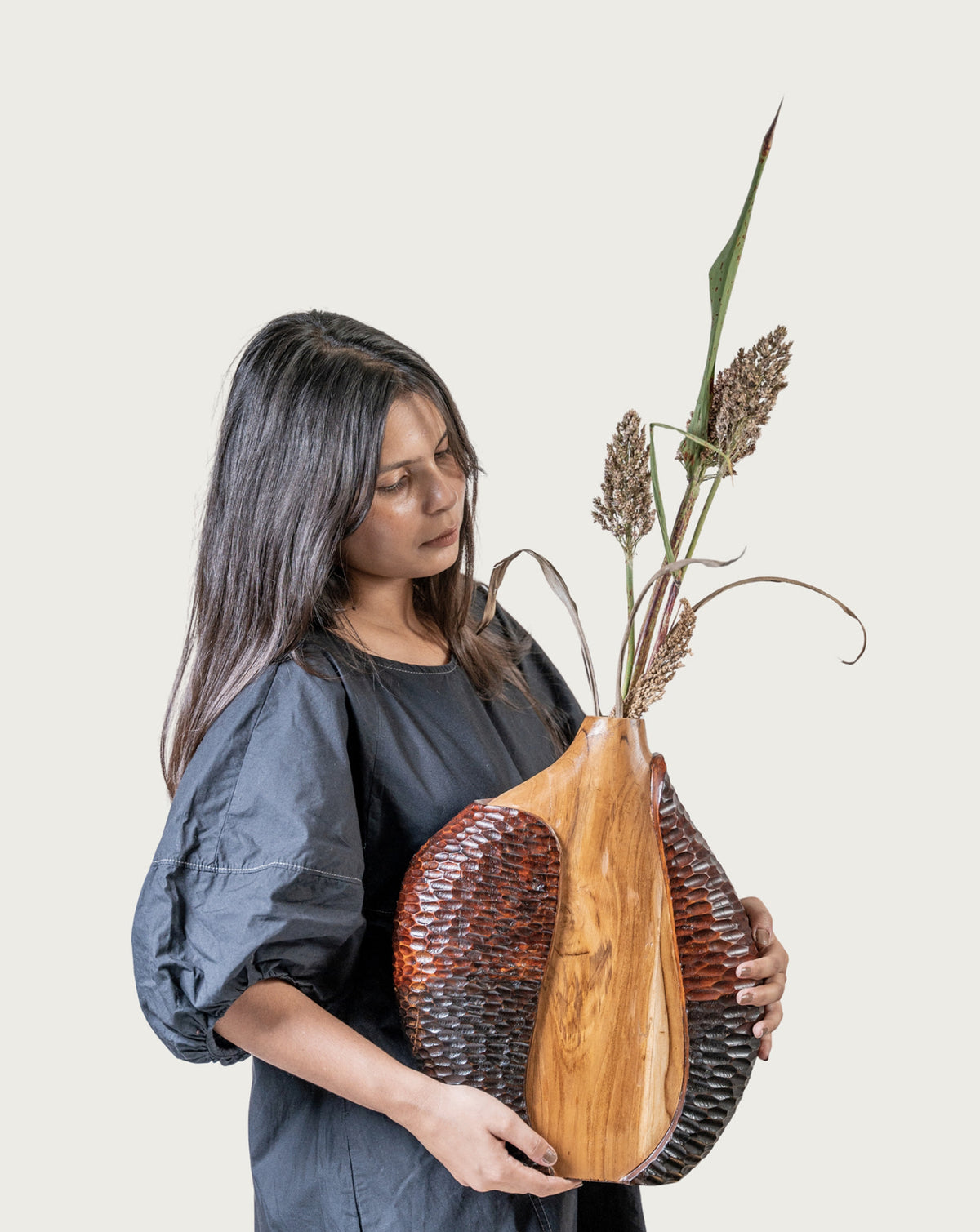 Side profile showing the upward rise and gentle taper of the wooden form