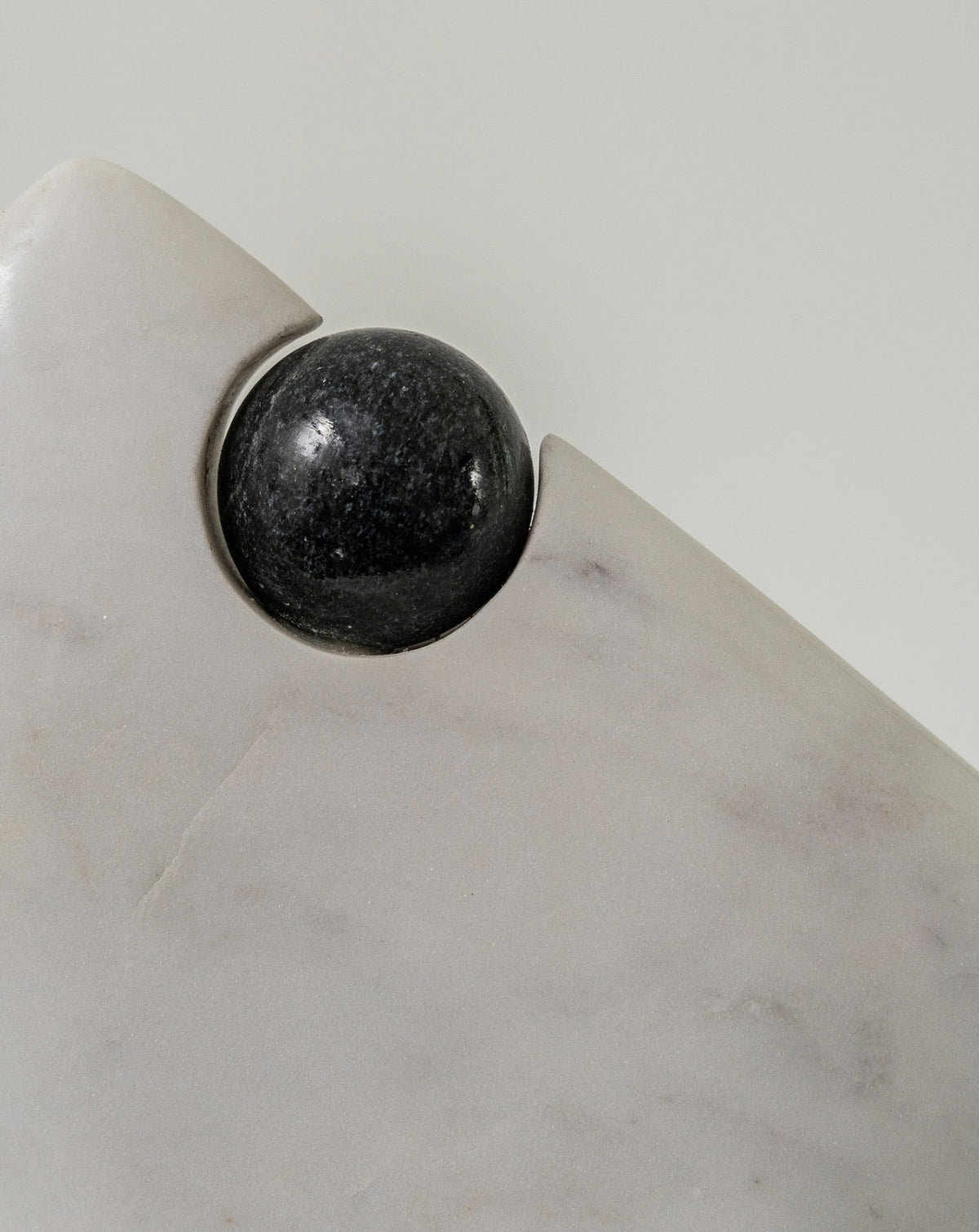 Solid marble vessel showing the contrast between black and white stone