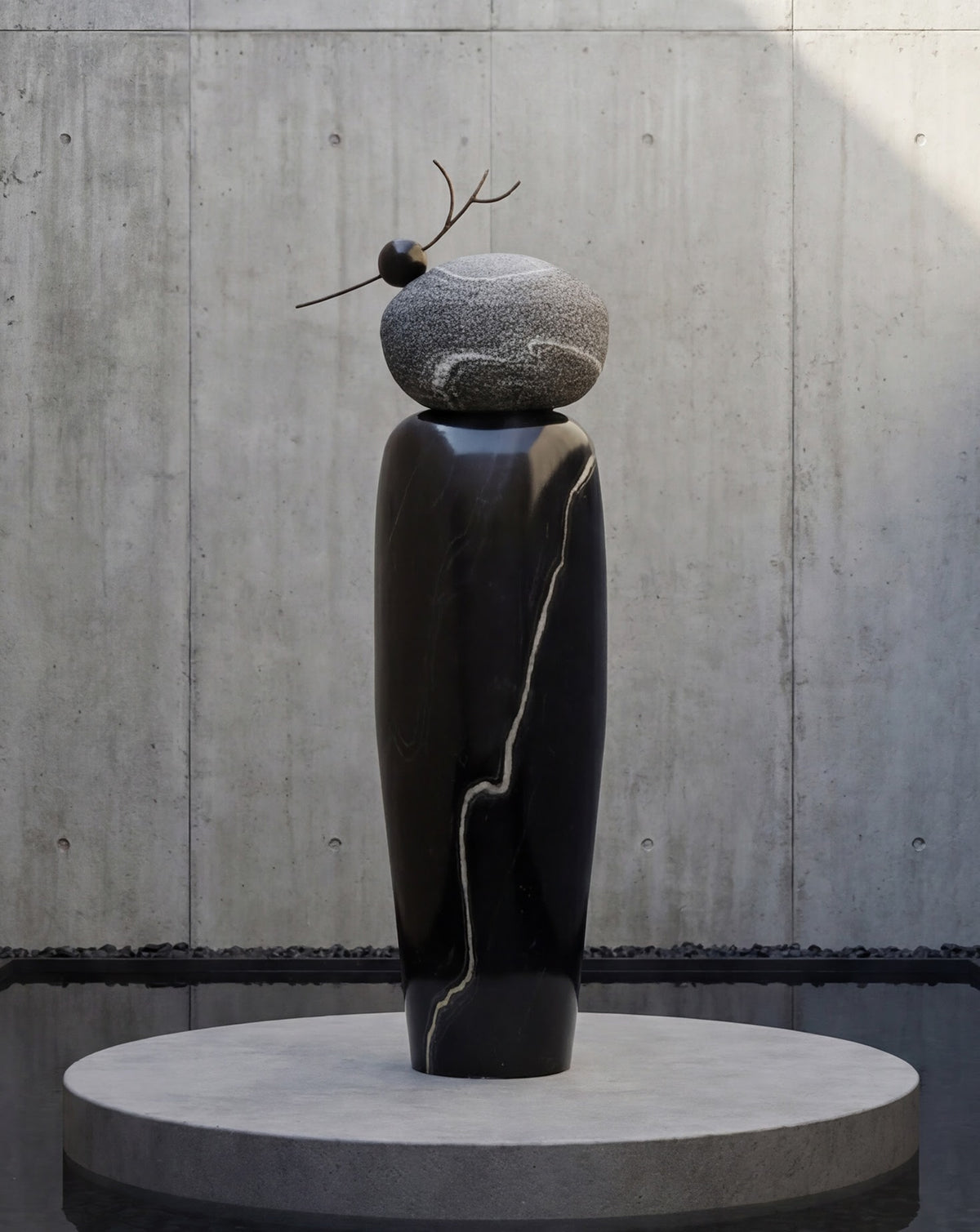 Detail of natural veining and depth inherent to hand-worked black marble