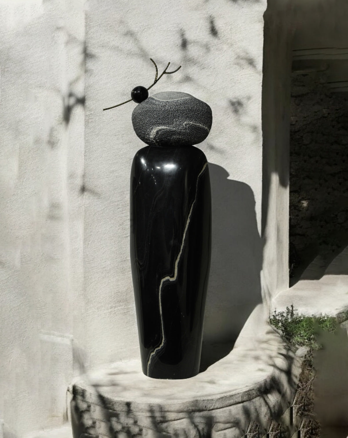 Interplay of smooth polished stone and tactile chiselled surfaces across the sculpted form