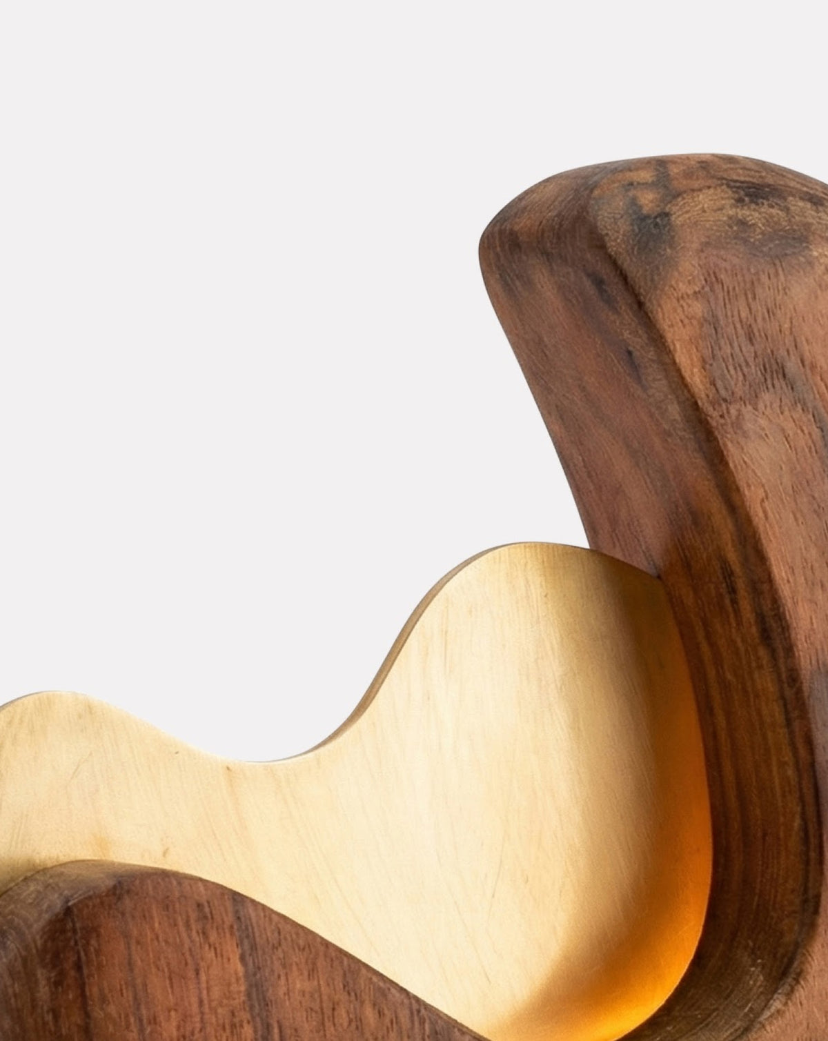 Fluid curved silhouette leaning upward, measuring 21 by 21 by 9 centimetres