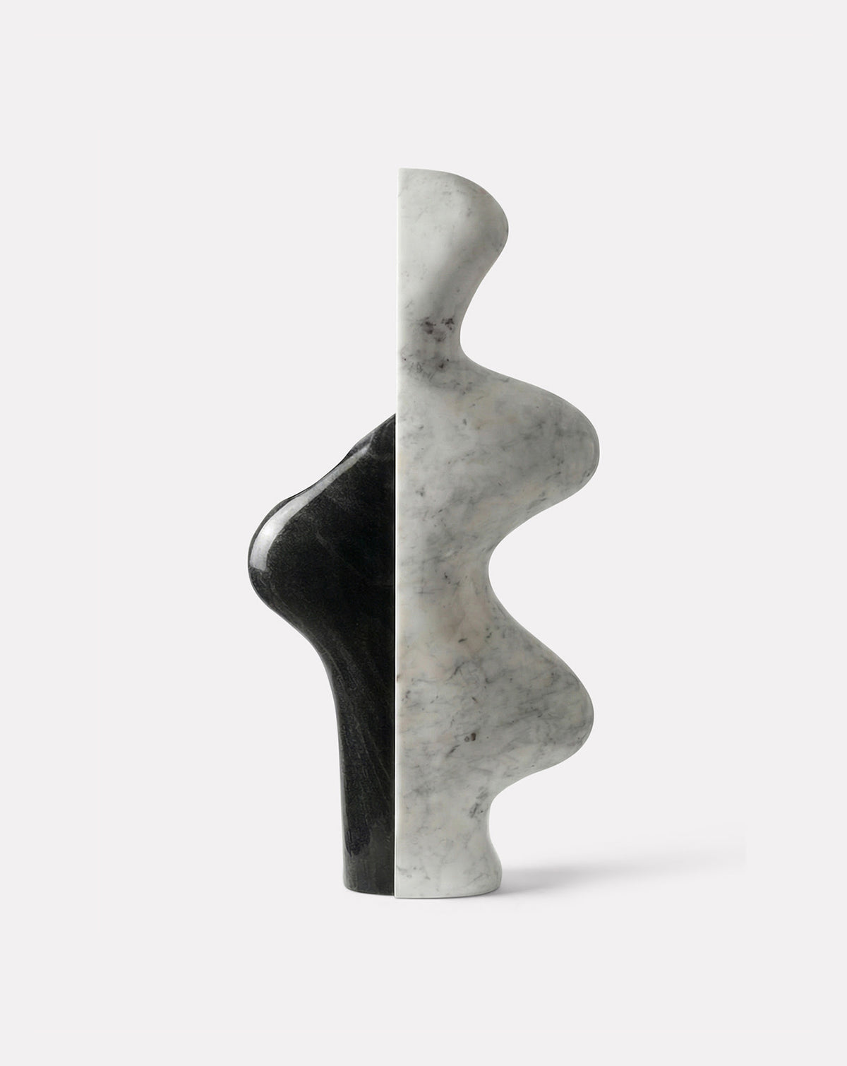 ADRI marble floor sculpture in black and white stone, a statement piece beside luxury kitchenware and open-plan living