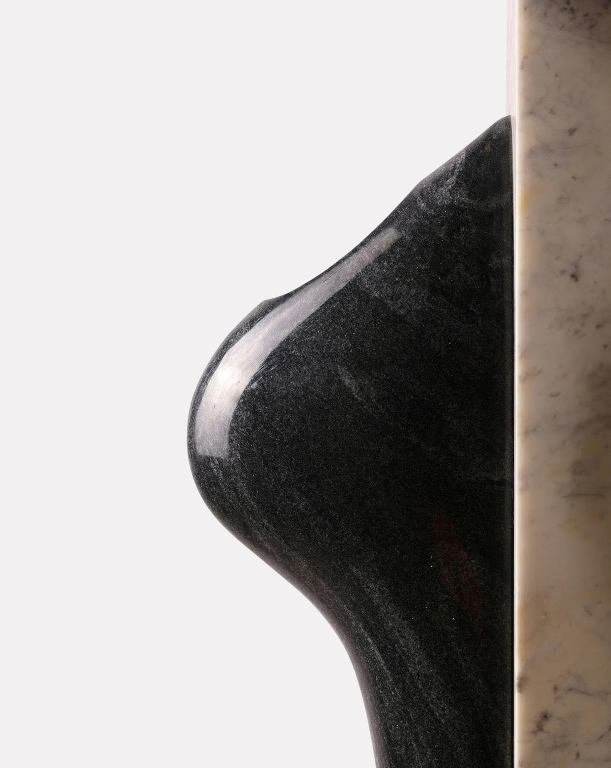 Integrated pocket within the marble form, sized for a small plant