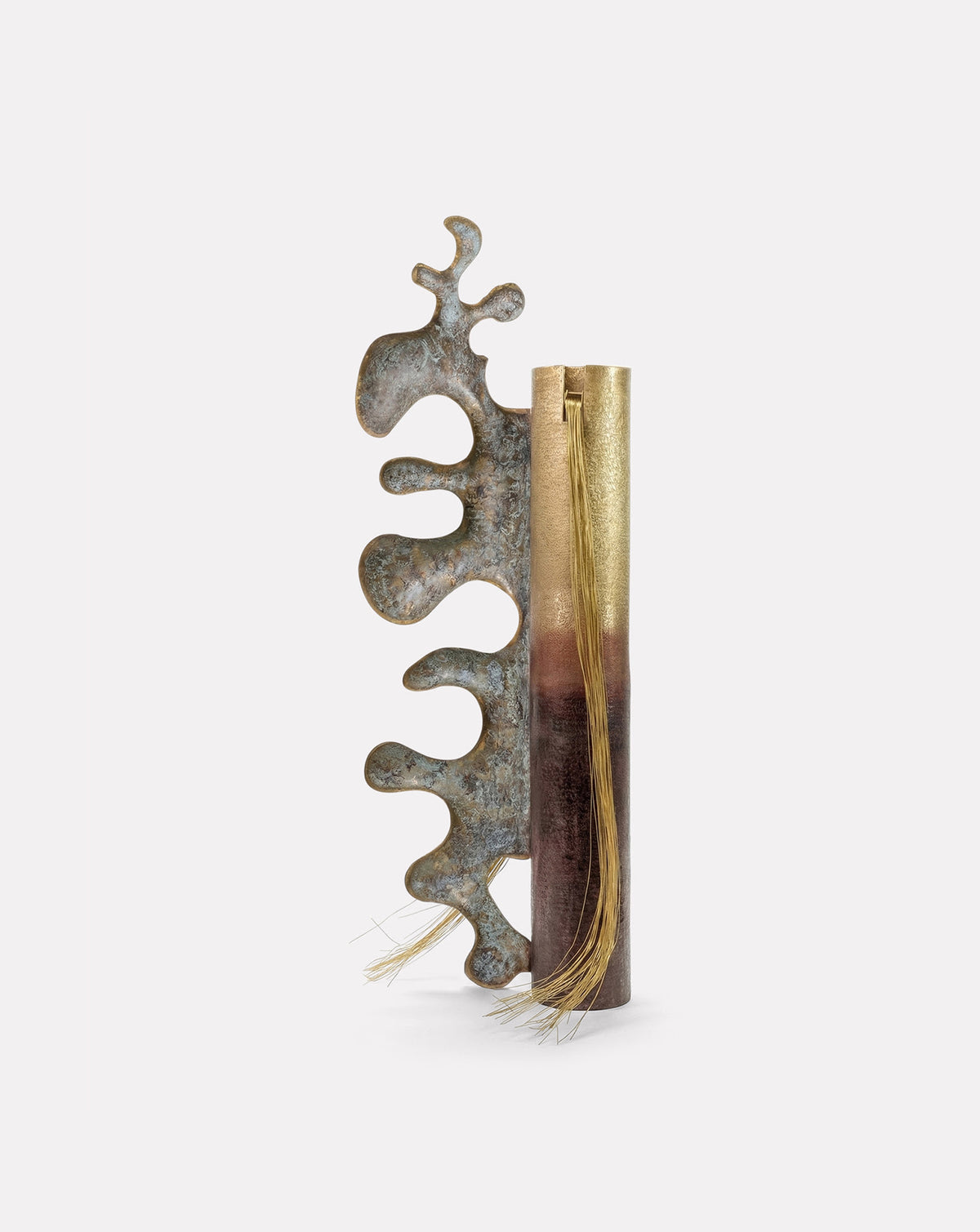Full height view showing the tapering silhouette and graduated patina from base to crown