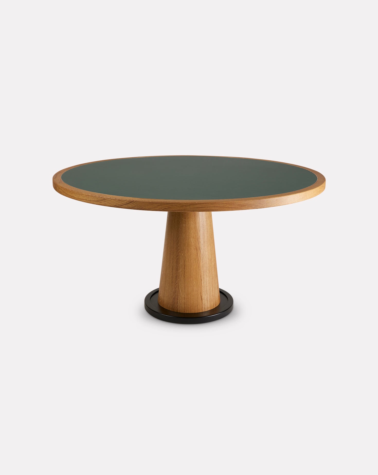 Round table with green top and wooden base on a white background