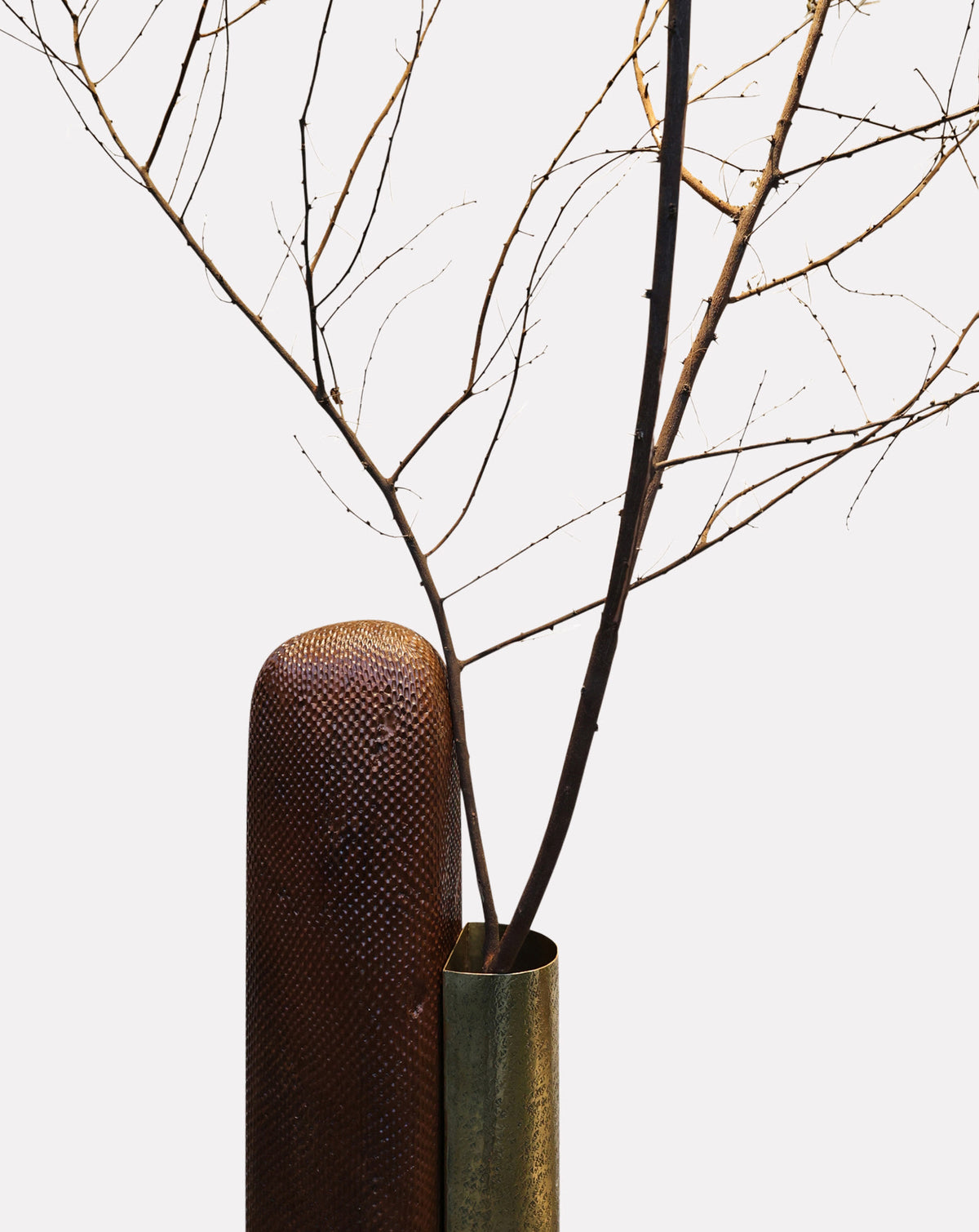 Close view of the brass detail set against richly textured solid teak wood