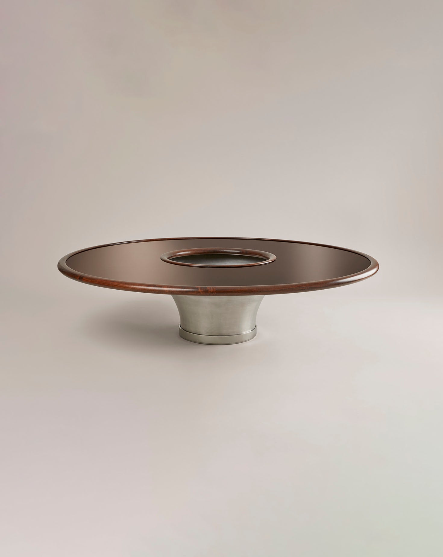 Decorative object with wooden top and metal base on a beige background