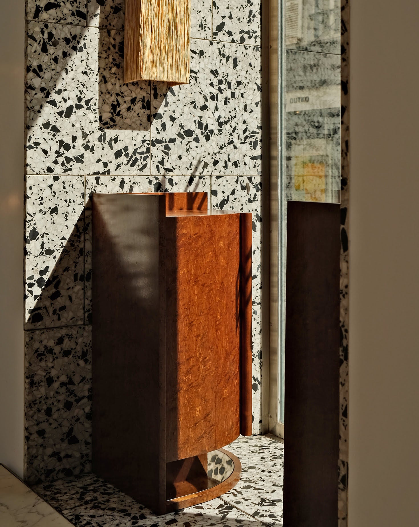 Decorative wall with terrazzo pattern and wooden accents